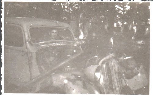 John Edward Olsen in a broken German car