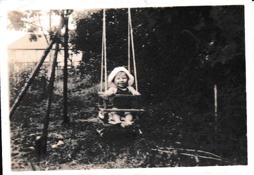 Baby John Olsen on swing. 1947